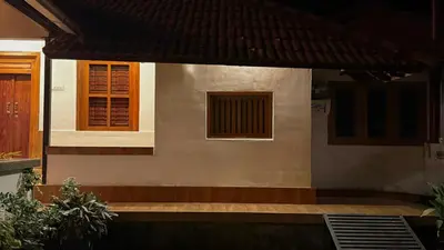 a house with a door and a window on it at PARTHO home stay in Padinjarathara