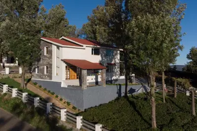 a model of a house with trees and a fence at StayVista at Villa Misty Oaks with Breakfast in Ooty
