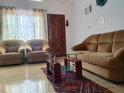 a living room with two couches and a coffee table at Casa Maria Mystica apartments, Mananthavady, Wayanad in Mānantoddy