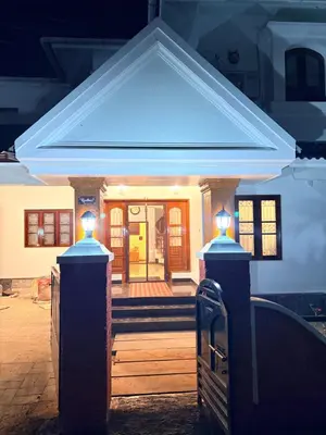 a house with lights on the front of it at 