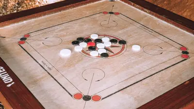 a game board with balls on top of it at Mountain Vibes Resort Wayanad in Wayanad