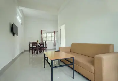 a living room with a couch and a table at Caravan holiday homes Vythiri in Vythiri