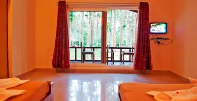 a room with two beds and a large window at Lazo Areca Resort , Coorg in Madikeri