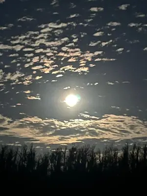 a cloudy sky with the sun in the middle at REHMANS HOMESTAY in Ooty